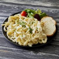 Fettuccine Alfredo · Fettuccine cooked in our special white cream sauce with Parmigiana cheese and seasoning.