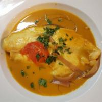 Sudado De Pescado · Fish fillet steamed with tomato and onions. Served with white rice.