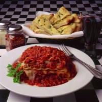 Mama's Meat Lasagna · Homemade meat sauce layered with pasta, seasoned ricotta and mozzarella, baked until bubbly....