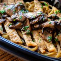 Chicken Marsala · Tender chicken breast sauteed with fresh mushrooms and Marsala wine, served with spaghetti M...