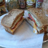 Turkey Bacon Ranch Sandwich · HoneyBaked smoked turkey, bacon, cheddar cheese, sliced tomato, fresh lettuce, thin sliced r...