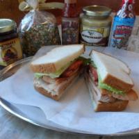 Cranberry Turkey Sandwich · HoneyBaked roasted turkey, fresh lettuce, sliced tomato, cranberry walnut chutney and champa...