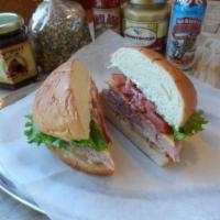 Tavern Club Sandwich · HoneyBaked ham, smoked turkey, bacon, cheddar cheese, fresh lettuce, sliced tomato, thin sli...