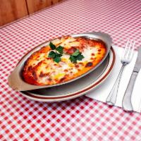 Manicotti · Stuffed with ricotta cheese, covered with meat sauce and melted cheese.