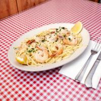 Linguine by the Sea · Our signature seafood dish: we saute 6 large prawns and lay them over a bed of linguine seas...