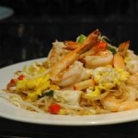 Shrimp Pad Thai · Thin rice noodles stir-fried with shrimps, bean curd, crushed peanuts, bean sprouts, scallio...