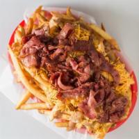 Pastrami Fries · A big basket of crispy french fries topped with 1000 Island, cheddar cheese, and pastrami.