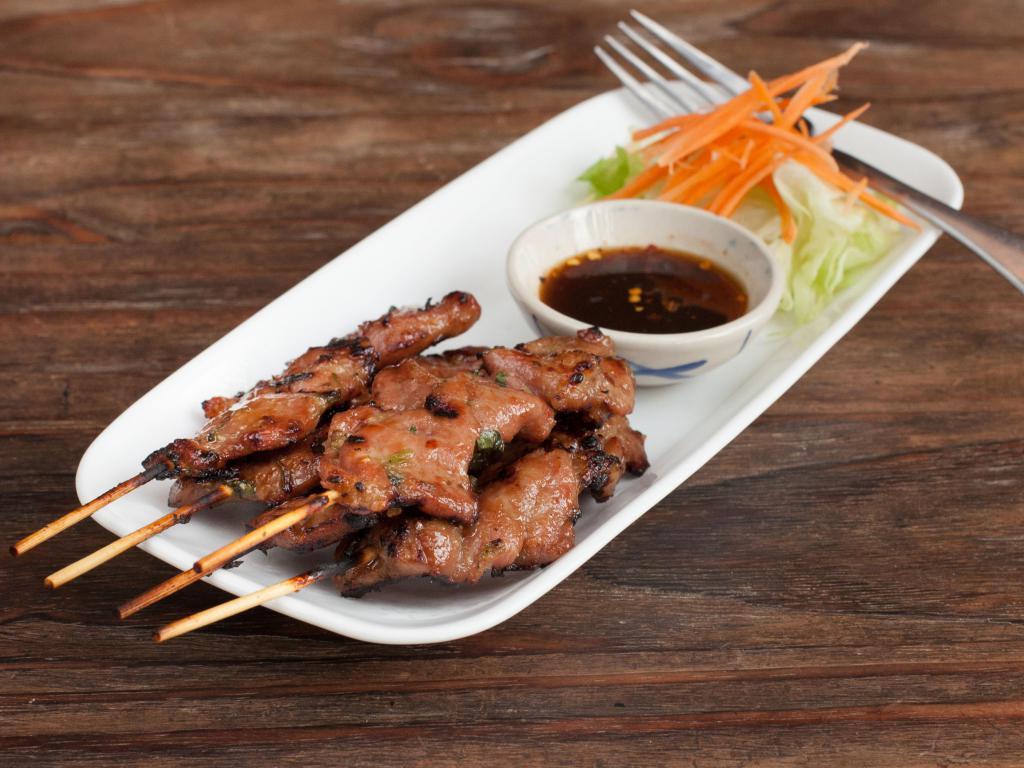 A1. Moo Ping หมูปิ้ง · Grilled marinated pork on a stick served with spicy home made sauce.