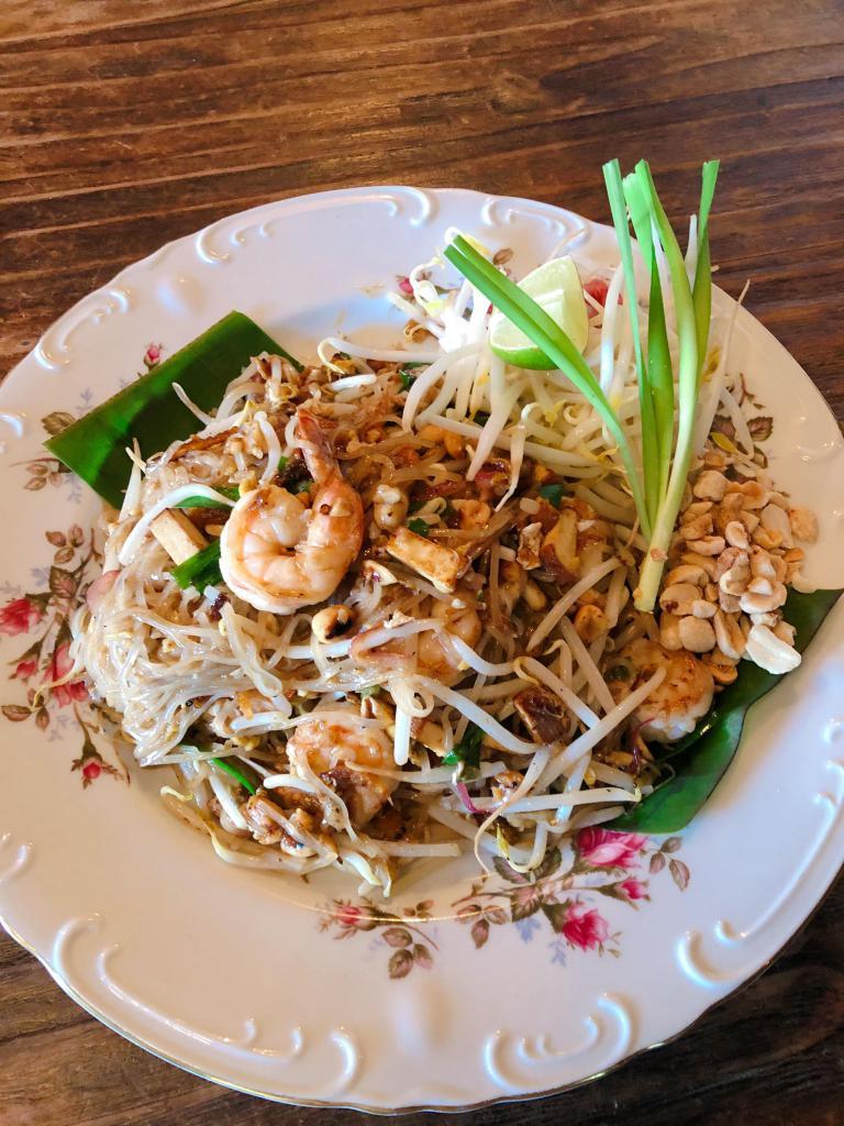 Pad Thai (contains DRIED SHRIMP) ผัดไทย · Rice noodles sauteed with choice of meat, DRIED SHRIMP, PEANUTS, egg, bean curd, bean sprouts, garlic chives and pickled turnip.