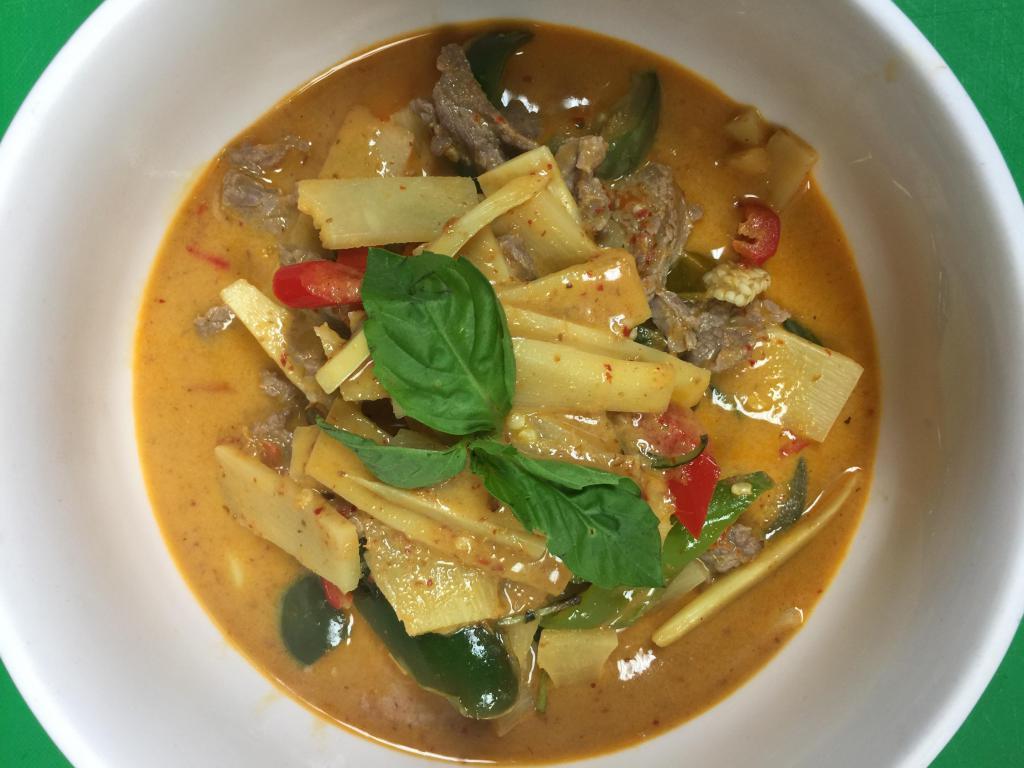 C2. Red Curry แกงเผ็ด · Red curry paste, Thai eggplant, bamboo shoot, fresh basil, bell pepper and and coconut milk. Spicy.