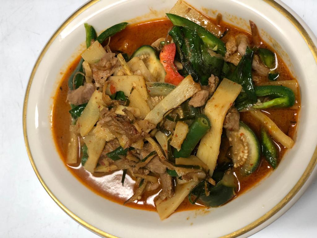 C4. Country Style Curry แกงป่า · Country style curry paste, bamboo, eggplant, string bean, basil and bell pepper. Spicy.