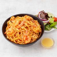 Shrimp Fra Diavolo · Plump shrimp sauteed in a fresh garlic, spicy marinara sauce served over linguini. Served wi...