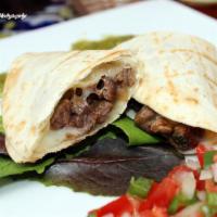 Caramelos · Grilled beef and cheese taco wrapped in a flour tortilla.
