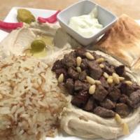 Hummus with Beef Shawarma · Hummus, beef shawarma, pine nuts and olive oil.