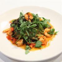 Linguini Neri con Gamberi · Homemade black linguini tossed with shrimp in a mild tomato sauce garnished with baby arugul...