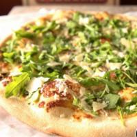 White Truffle and Arugula Pizza · No sauce, truffle oil, mushrooms, finished off with fresh arugula and shaved Parmesan cheese...