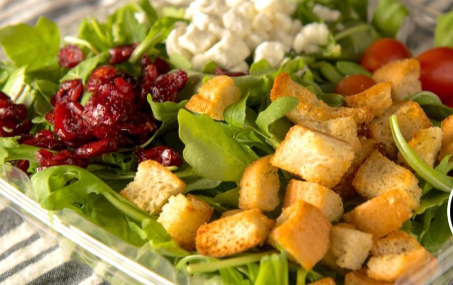 Arugula Salad · Goat cheese, croutons, dried cranberries and cherry tomatoes.