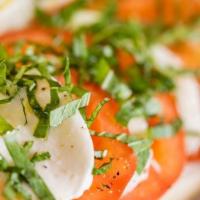 Caprese Salad · Romaine, fresh mozzarella, tomatoes, topped with fresh basil.