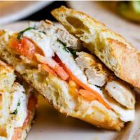 Grilled Chicken Panini · Fresh mozzarella, tomatoes, fresh basil, imported extra virgin olive oil, herbs, salt and pe...