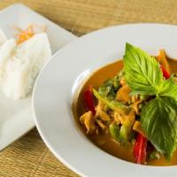 32. Gang Dang · Red curry. Red curry paste in coconut milk with bell peppers, zucchini, bamboo shoots, sweet...