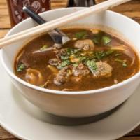 Beef Noodle Soup · Marinated beef in beef broth noodle soup.