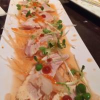 Albacore Tataki · Seared white tuna served with sweet onion and radish ponzu sauce.