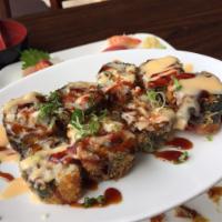 Fire Cracker Balls Roll · Deep fried fish served with house spicy sauce, scallions and sesame seeds.
