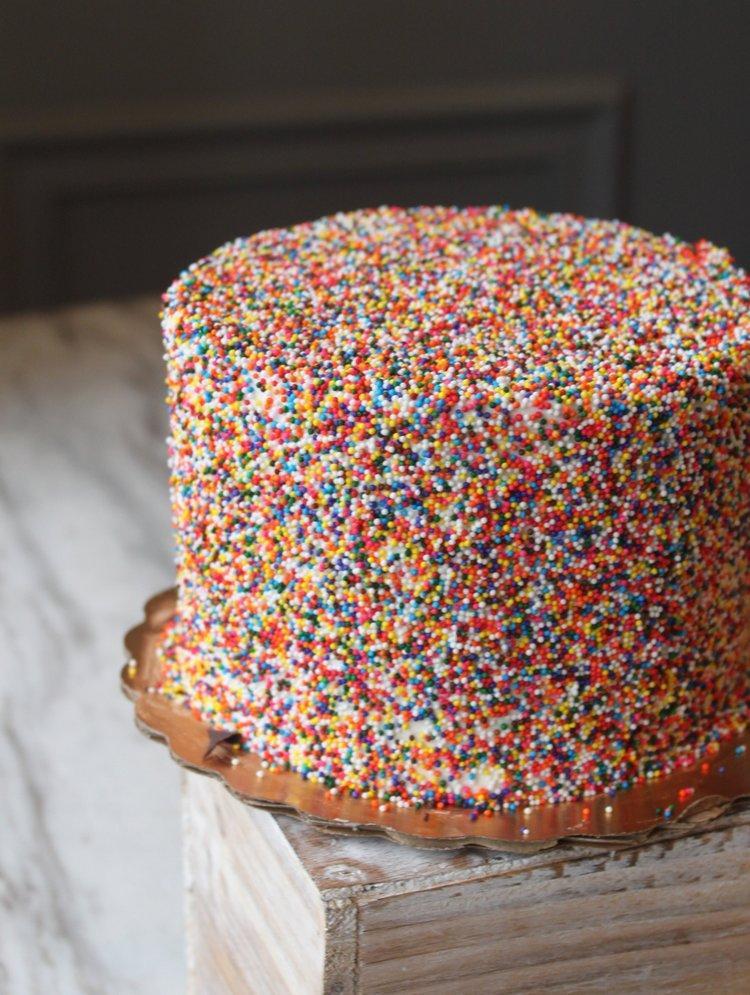 Sprinkle · Vanilla Cake with Sprinkles, Vanilla Buttercream Filling & Frosting, Covered in Colorful Sprinkles