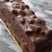 Macadamia Caramel Bar · Two layers of macadamia browned butter cake with salted caramel filling, topped with macadam...
