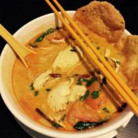Tom Kha Noodle Soup · Spicy coconut lemongrass soup, mushrooms, tomatoes, and cilantro.
