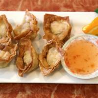 3. Crab Delight · Crab meat mixed with cream cheese and wrapped in wonton sheets. Deep-fried, then served with...