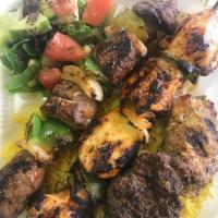 14. Meat Combo · A combination of chicken kabob, kofta kabob and beef kabob. Served with hummus, rice, vegeta...