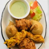 A11. Mixed Sampler · Vegetable meat samosa, chicken and vegetable pakora.
