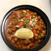 V8. Channa Masala · Chick peas cooked with tomato, onions, garlic and ginger. Served with rice. Gluten-free.