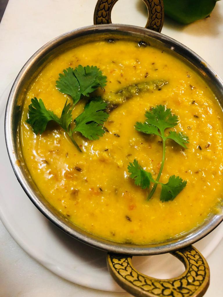 V10. Tadka Dal · Yellow lentils with cumin, garlic and spices. Served with rice. Gluten-free.