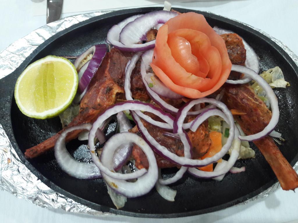 T7. Lamb Chop · Lamb marinated in ginger, ajwaein (carom seeds) and spices. Served with rice. Gluten-free.
