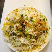 R2. Chicken Biryani · Cooked aromatic basmati rice, richly flavored saffron, herbs and spices. Served with raita. ...
