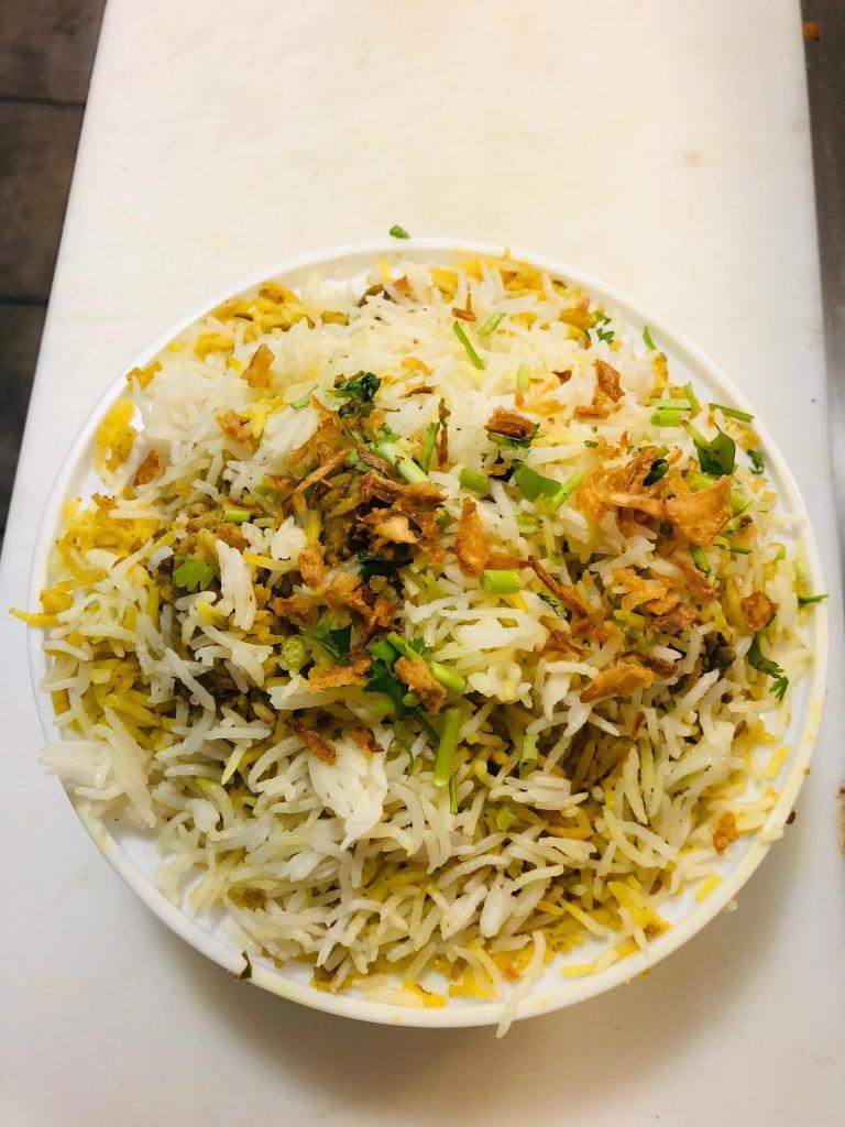 R2. Chicken Biryani · Cooked aromatic basmati rice, richly flavored saffron, herbs and spices. Served with raita. Gluten free.
