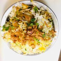 R5. Shrimp Biryani · Cooked aromatic basmati rice, richly flavored saffron, herbs and spices. Served with raita. ...