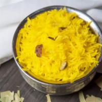 R6. Saffron Rice · Cooked Aromatic basmati rice richly flavored saffron, herbs and spices. Served with raita. G...