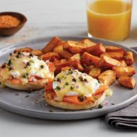 Smoked Salmon Benedict · Cold-smoked Atlantic salmon and poached eggs, topped with hollandaise sauce, diced red onion...