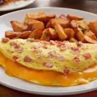 Bacon, Ham & Sausage Omelet · Three eggs, hickory-smoked bacon, ham, pork sausage, andouille sausage, tomato, and melted c...