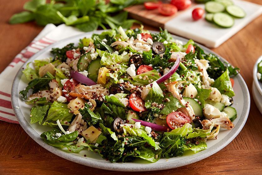 Chicken & Quinoa Mediterranean Salad · Pulled roasted chicken, tomatoes, cucumbers, artichoke hearts, onions, olives, and quinoa blend on romaine lettuce tossed in red wine shallot vinaigrette.