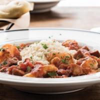  Jambalaya · Shrimp, chicken and andouille sausage, bell peppers, and onions in a French Basque tomato sa...