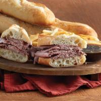 French Dip Sandwich · Sliced roast beef on a ciabatta bread with a side of au jus. Add bell peppers, caramelized o...