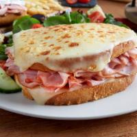 Croque Monsieur · Smoked ham and Swiss cheese served warm on toasted sourdough topped with mornay sauce and me...