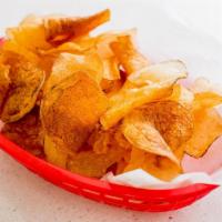 House Made Chips · Thinly Sliced Idaho Potatoes, Fried Crispy & Seasoned with Salt & Pepper.