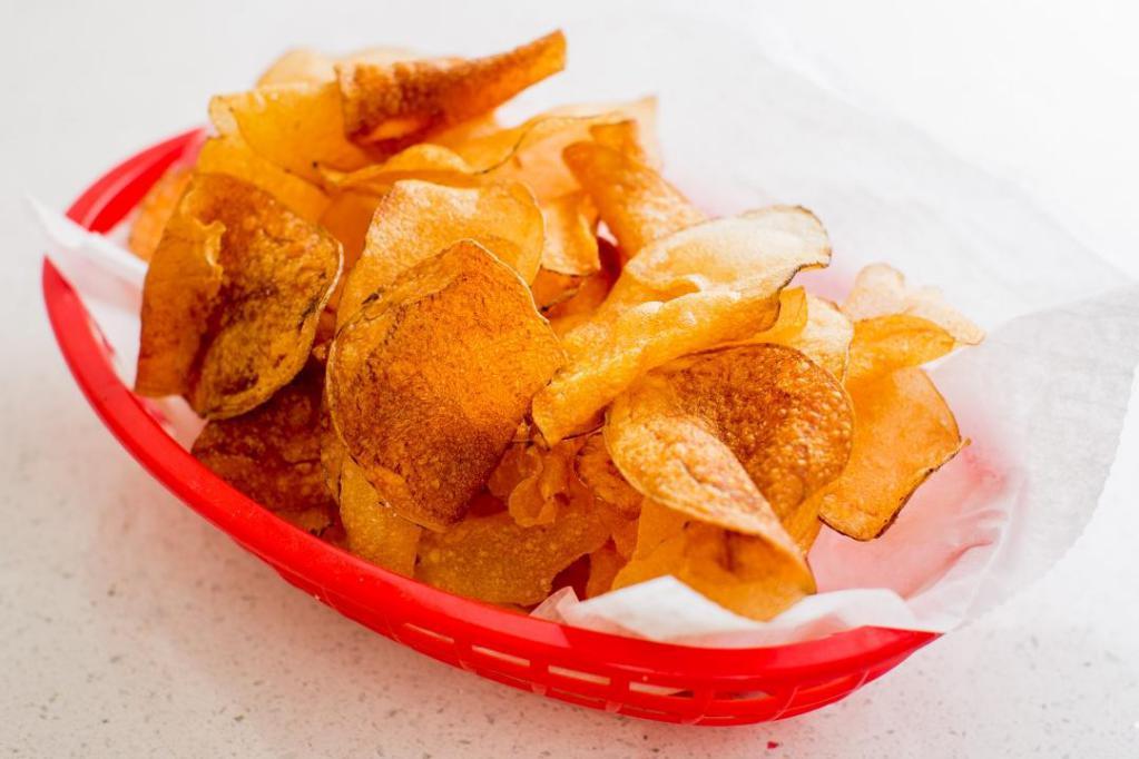 House Made Chips · Thinly Sliced Idaho Potatoes, Fried Crispy & Seasoned with Salt & Pepper.