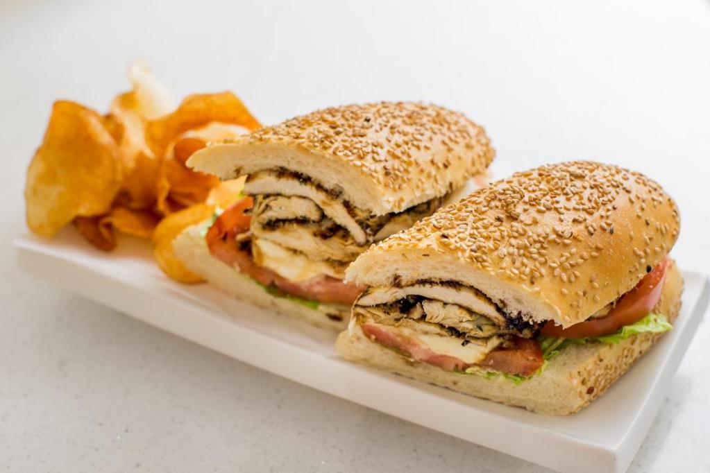 Chicken Caprese Hero · Grilled chicken, fresh mozzarella, lettuce, tomato, light mayoand balsamic glaze on a toasted sesame hero with house made chips or side salad
