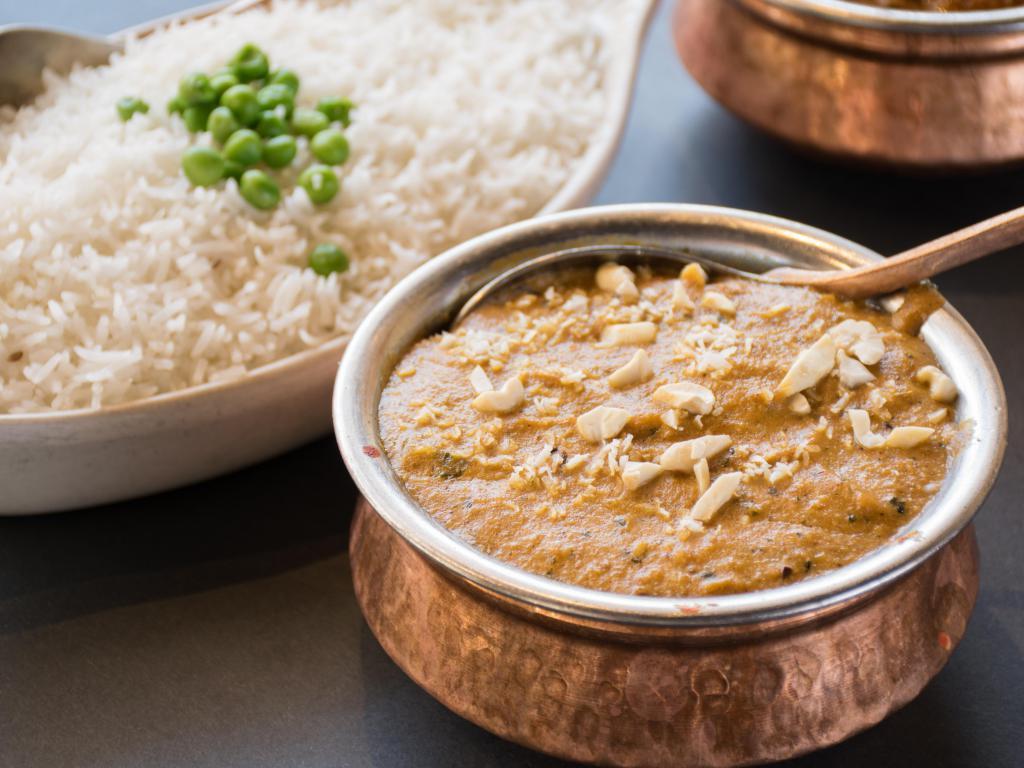 Lamb Korma · A very special dish of tender marinated pieces of boneless meat, cooked with onion, whipped cream, yogurt, nuts and delicately spiced. **Onions cannot be removed.